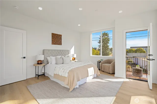 a bedroom with a large bed and a couch