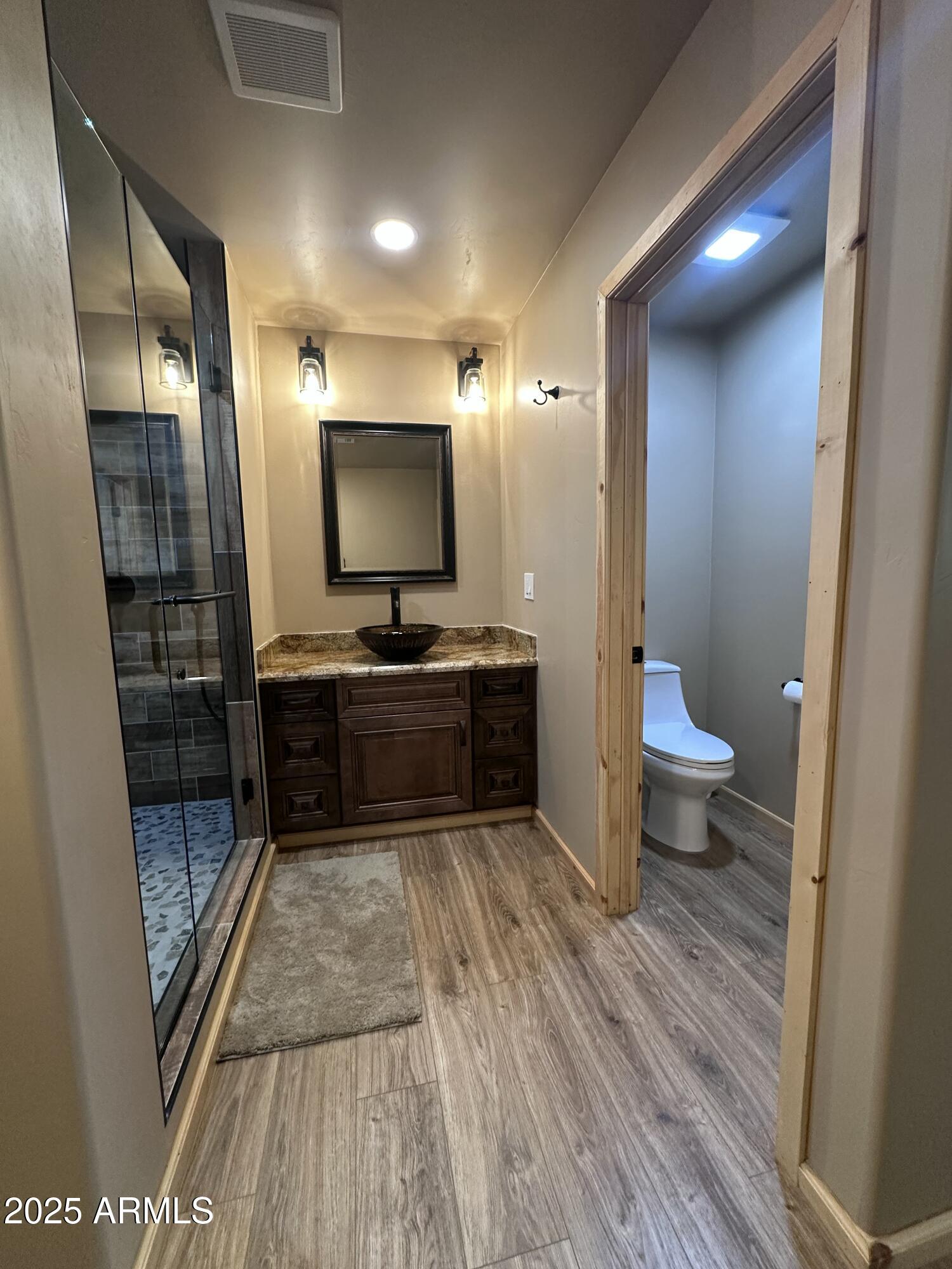 3457 Whispering Pines Road Pine, AZ 85544 - Photo 18 of 27 a bathroom with a sink and a mirror