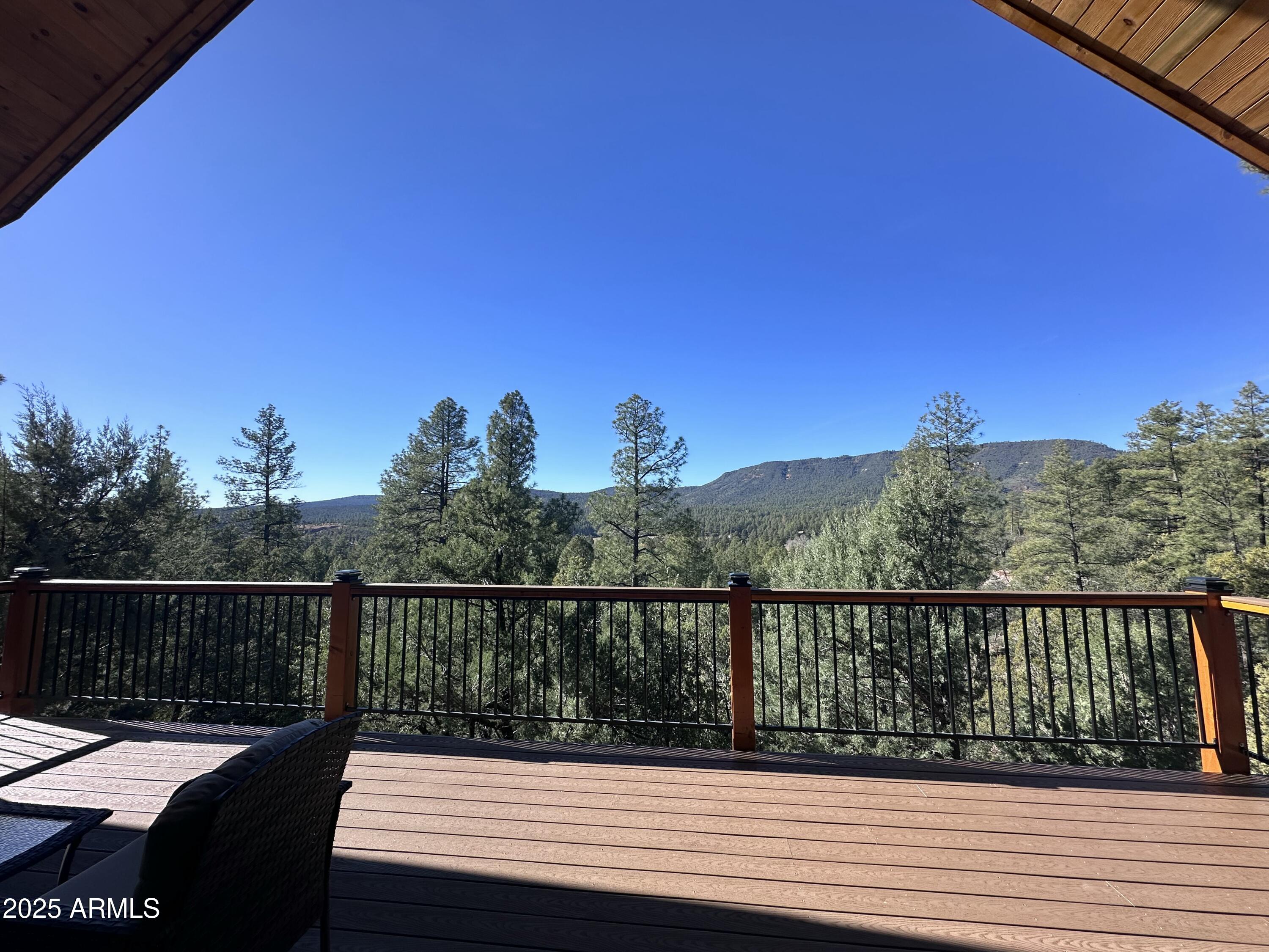 3457 Whispering Pines Road Pine, AZ 85544 - Photo 21 of 27 a view of a balcony with wooden floor and city view