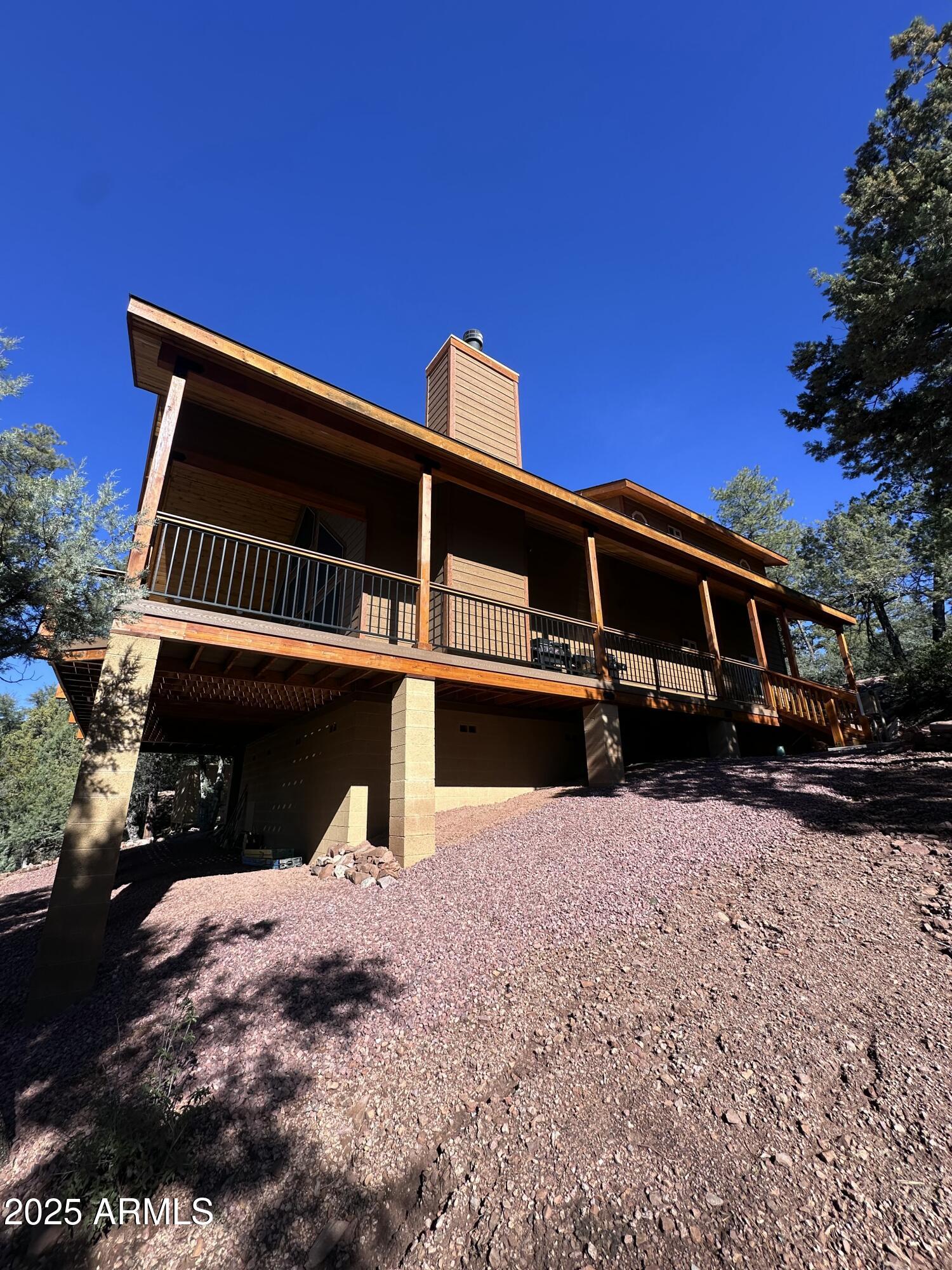 3457 Whispering Pines Road Pine, AZ 85544 - Photo 24 of 27 a view of a house with a yard