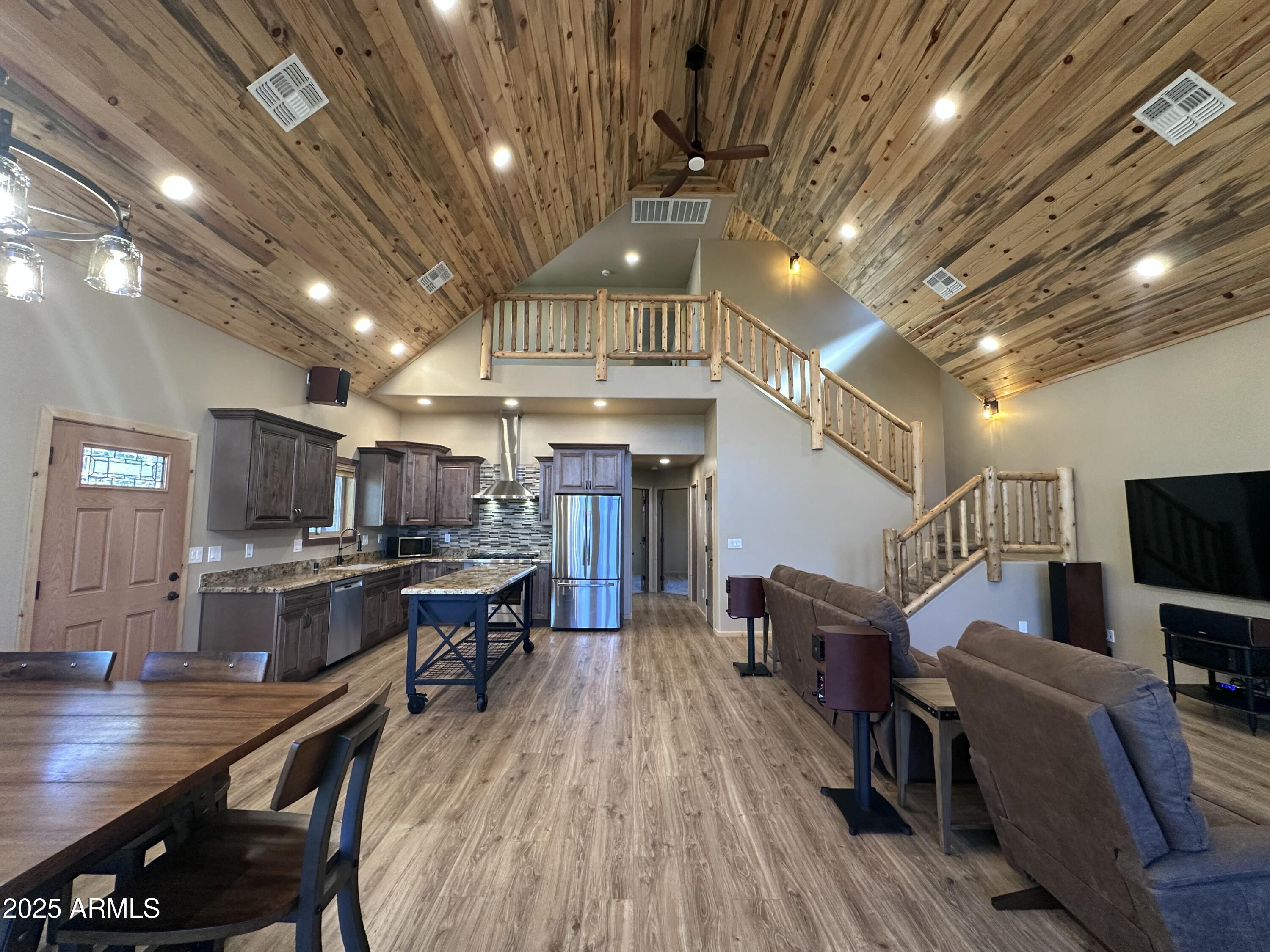 3457 Whispering Pines Road Pine, AZ 85544 - Photo 3 of 27 a view of kitchen center island dining table wooden floor and a kitchen