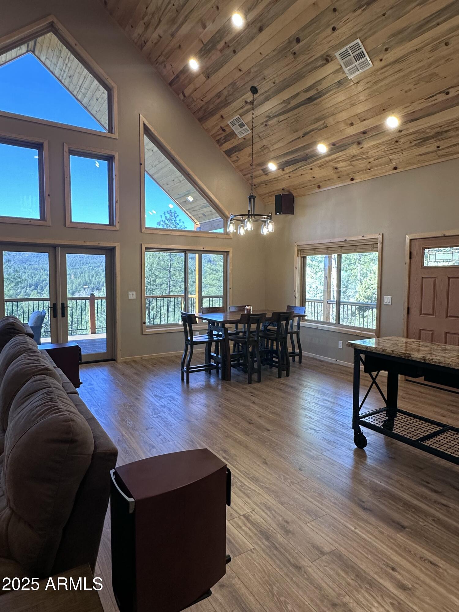 3457 Whispering Pines Road Pine, AZ 85544 - Photo 4 of 27 a living room with furniture and a wooden floor