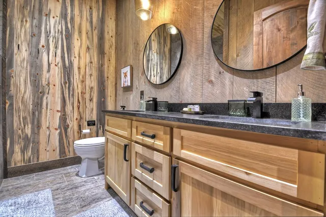 a living room with furniture a fireplace and a floor to ceiling window