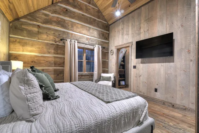 a living room with furniture fireplace and flat screen tv