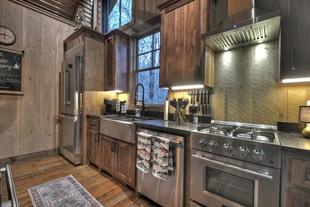 a view of a house with backyard porch and sitting area