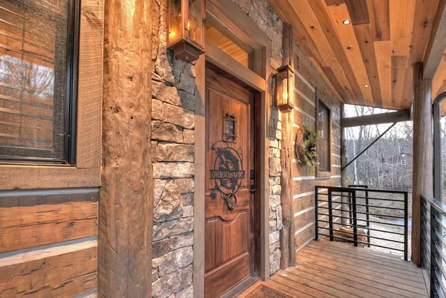 a dining table chair next to a window