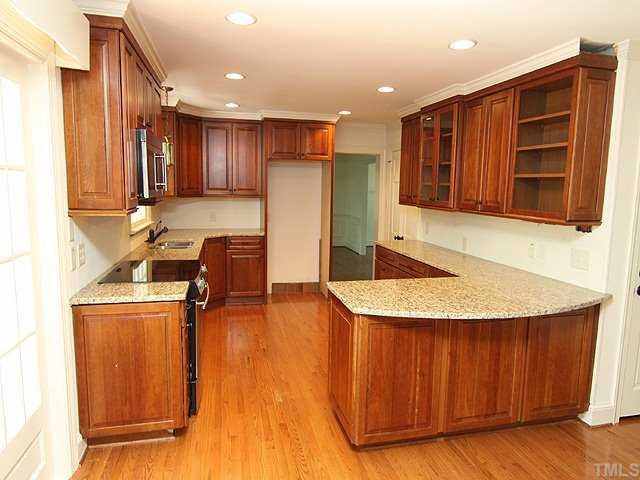 6616 Pleasant Pines Drive Raleigh, NC 27613 - Photo 4 of 15 Updated kitchen w/ granite countertops and new cabinetry. Kitchen
