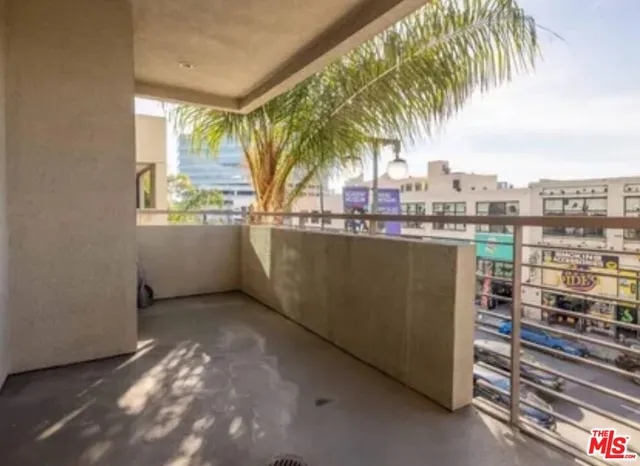 a view of balcony and yard