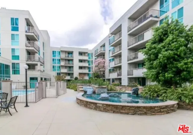 a front view of a building with a yard