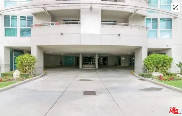 a front view of a house with a garage and glass windows