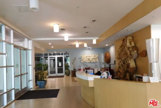 a view of a living room with a large window