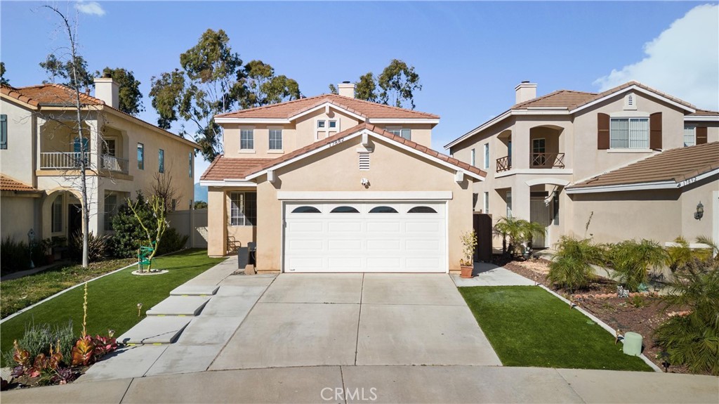 17882 Spring Hill Way Riverside, CA 92503 - Photo 1 of 1 a view of a white house with a big yard and large trees