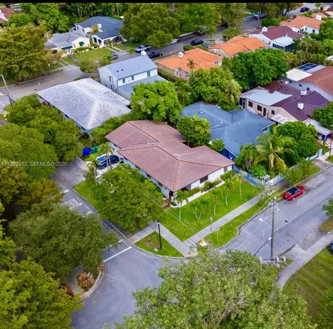 an aerial view of a house with a garden