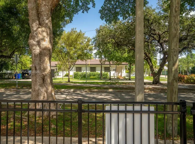 a view of a park with swings and slides