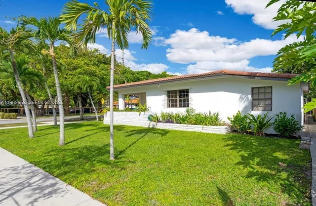 a house view with a garden space