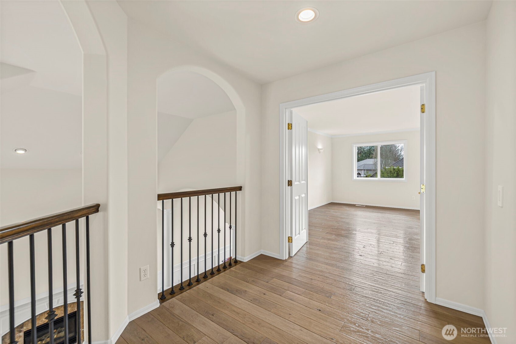 2018 242nd Street Southeast Bothell, WA 98021 - Photo 12 of 26 a view of a hallway with wooden floor and stairs