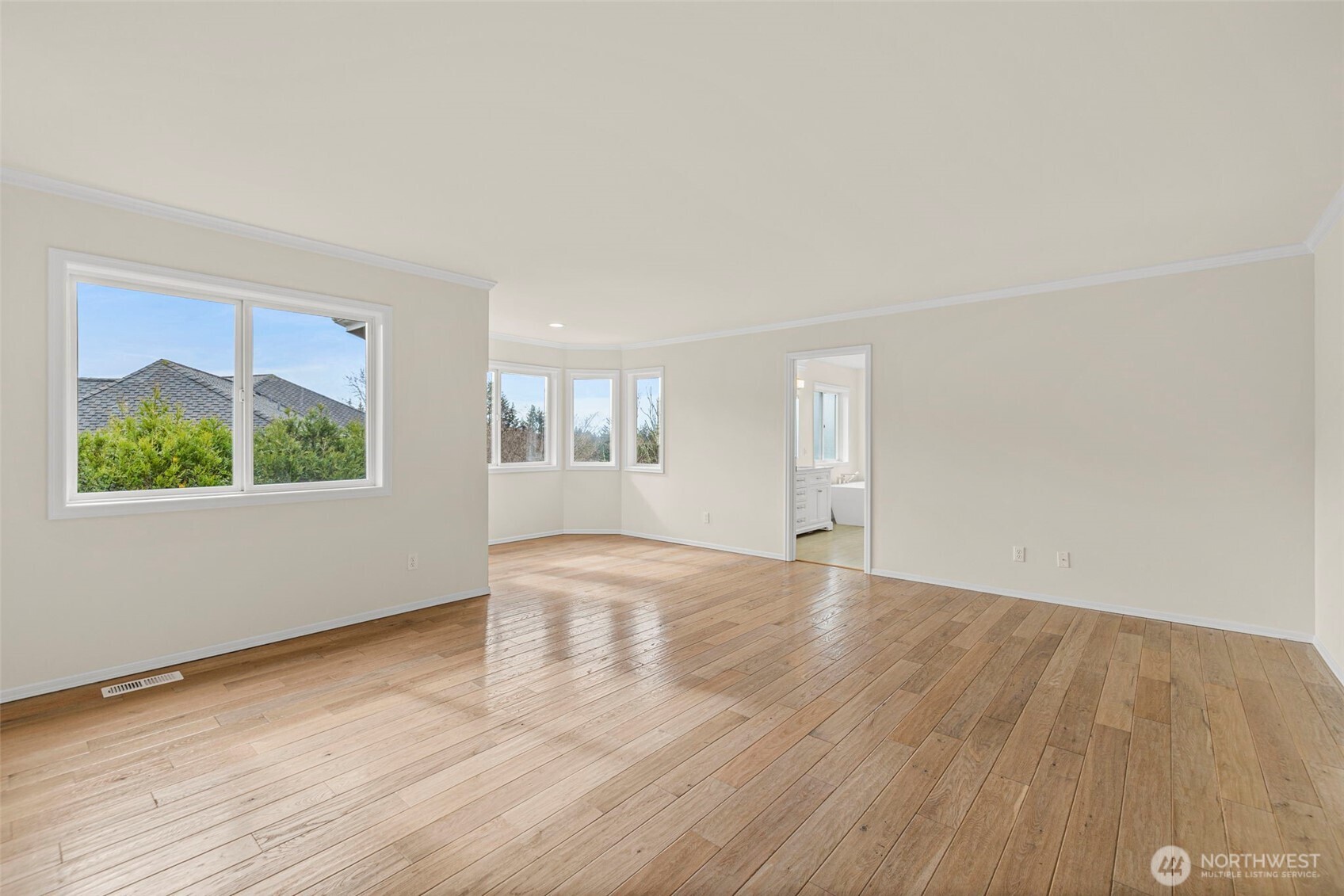 2018 242nd Street Southeast Bothell, WA 98021 - Photo 14 of 26 an empty room with wooden floor and windows