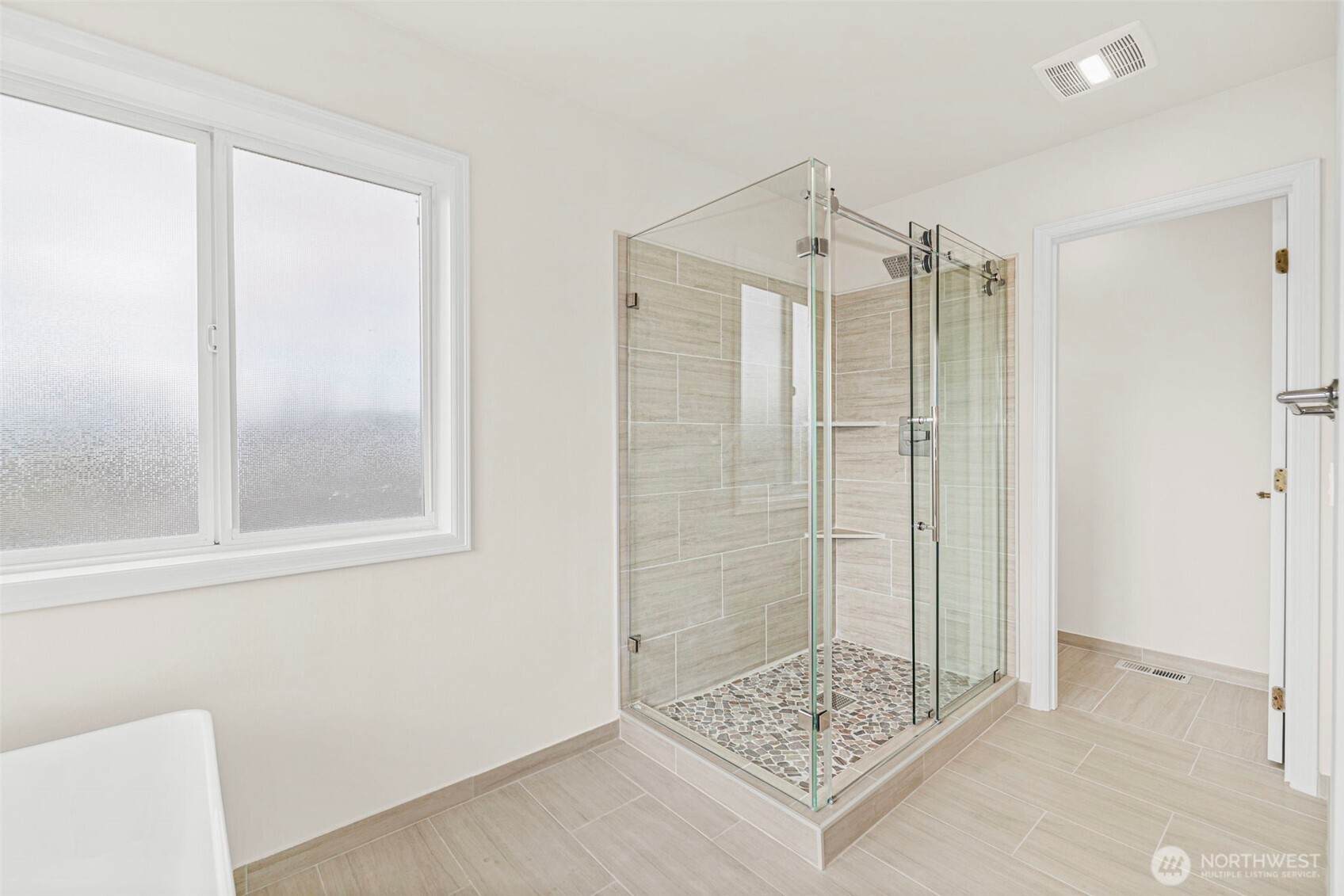 2018 242nd Street Southeast Bothell, WA 98021 - Photo 17 of 26 a bathroom with a shower and a sink