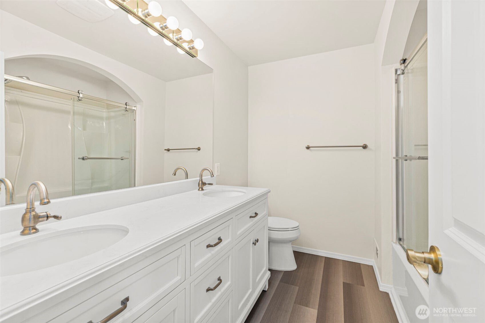 2018 242nd Street Southeast Bothell, WA 98021 - Photo 19 of 26 a bathroom with a sink a toilet and a mirror