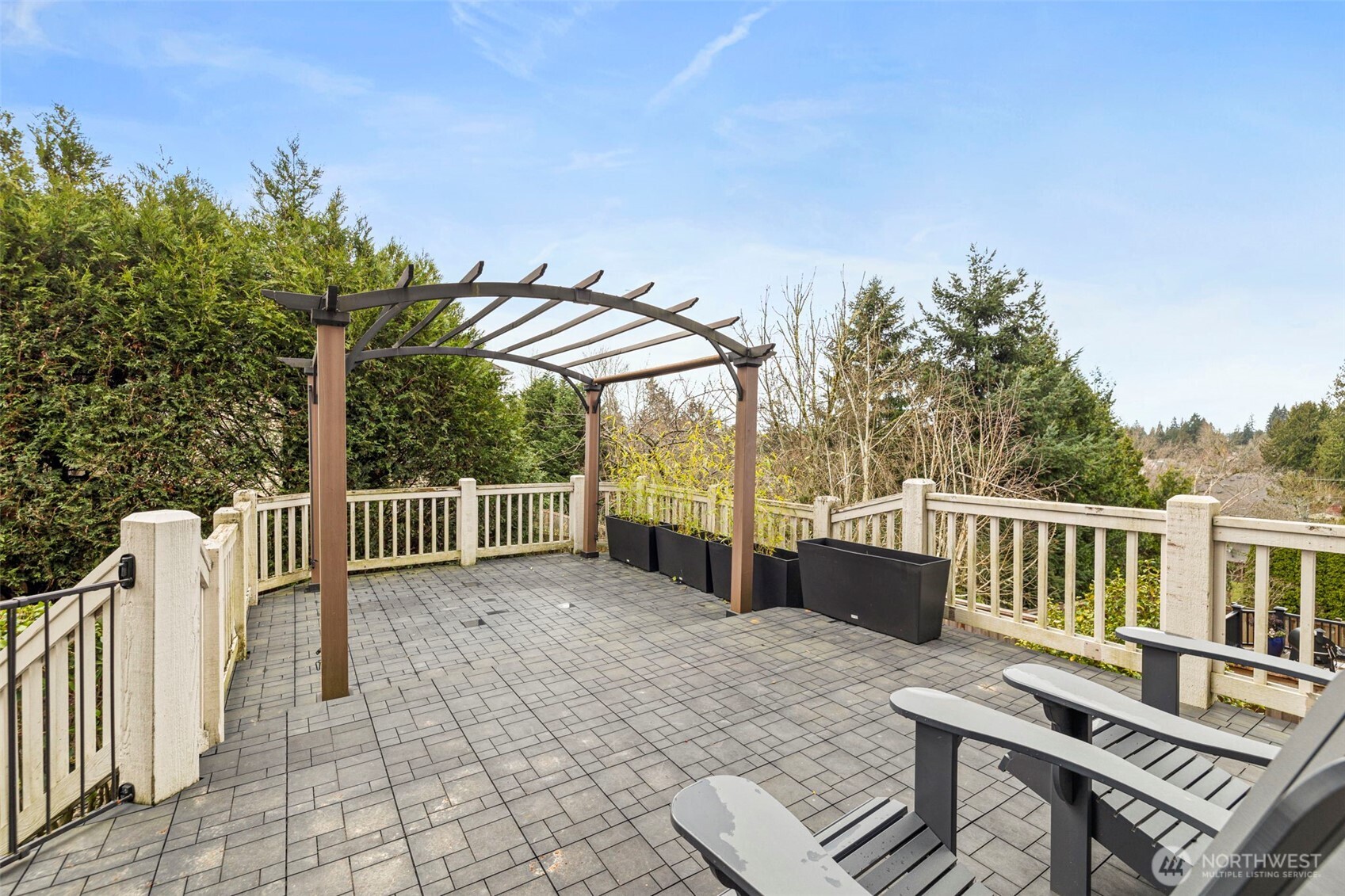 2018 242nd Street Southeast Bothell, WA 98021 - Photo 22 of 26 a view of a roof deck with chair and wooden floor
