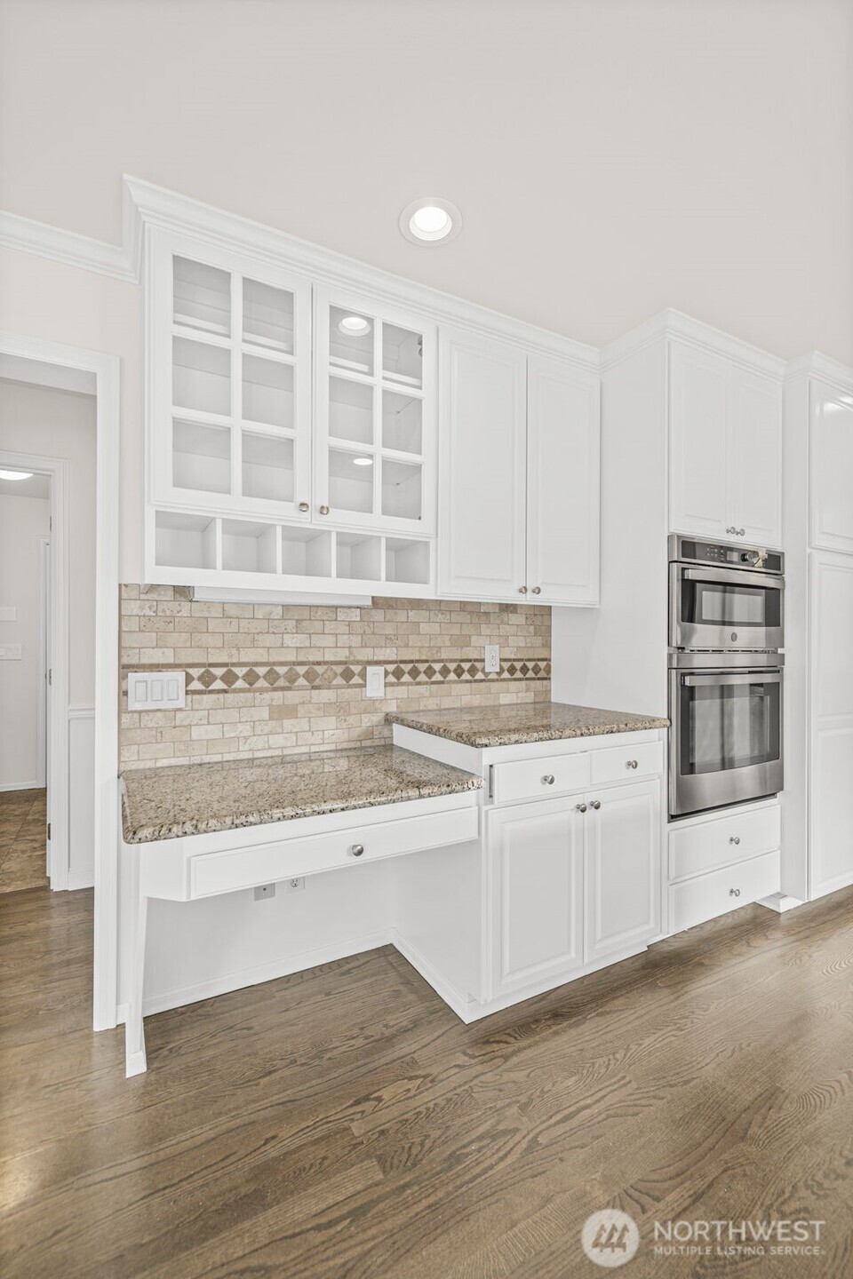 2018 242nd Street Southeast Bothell, WA 98021 - Photo 8 of 26 a kitchen with granite countertop a stove and a sink