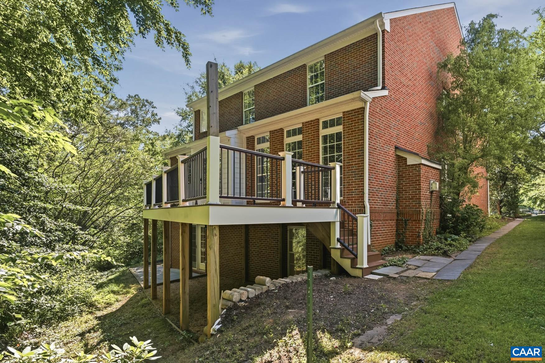 700 Rainier Road Charlottesville, VA 22903 - Photo 3 of 41 Beloved rear deck, peaceful wooded backdrop, and finished walkout terrace below.