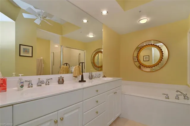 a bathroom with a sink double vanity and a mirror
