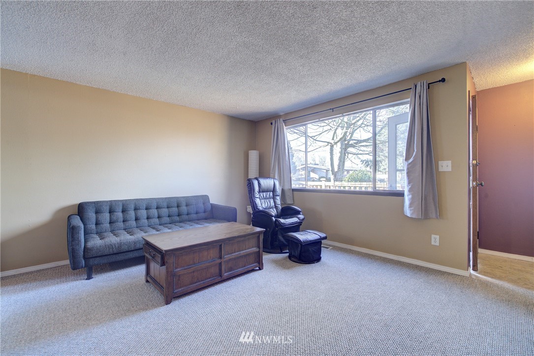 126 Pelly Avenue North, Unit AB Renton, WA 98057 - Photo 2 of 23 a living room with furniture and a window