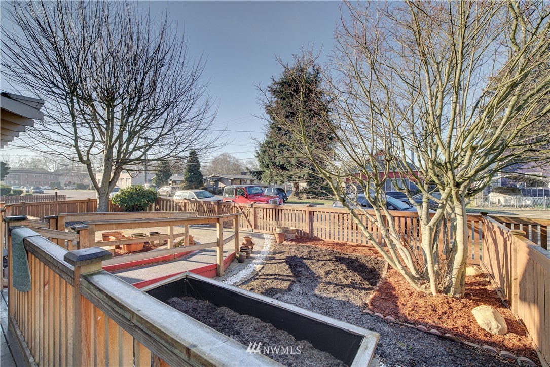 126 Pelly Avenue North, Unit AB Renton, WA 98057 - Photo 17 of 23 a view of a wooden deck with a trees