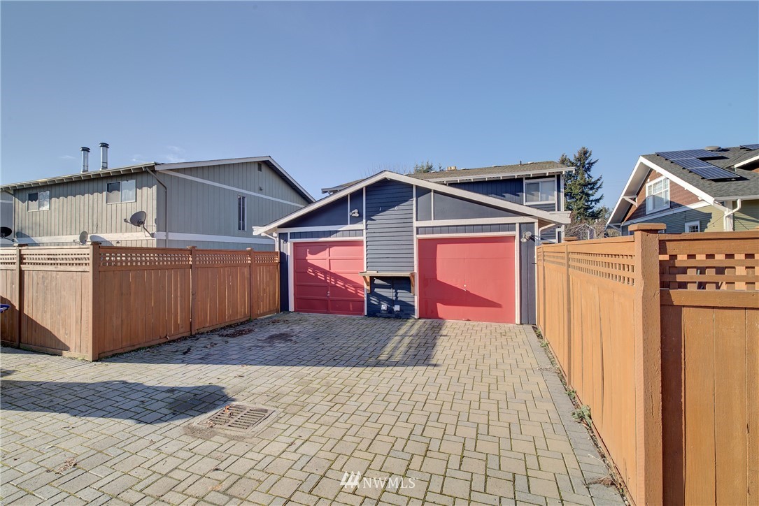 126 Pelly Avenue North, Unit AB Renton, WA 98057 - Photo 21 of 23 a view of a house with a yard