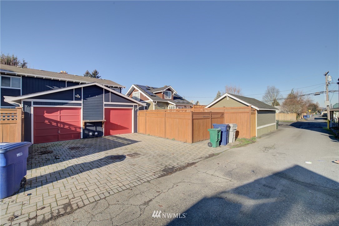 126 Pelly Avenue North, Unit AB Renton, WA 98057 - Photo 22 of 23 a front view of a house with a yard and garage