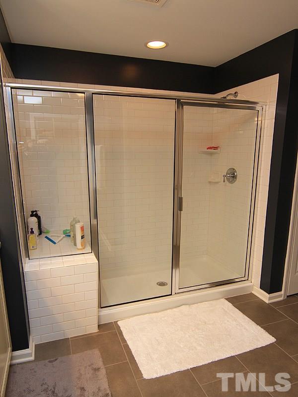 2305 Lowden Street Raleigh, NC 27608 - Photo 14 of 25 a bathroom with a shower and a sink