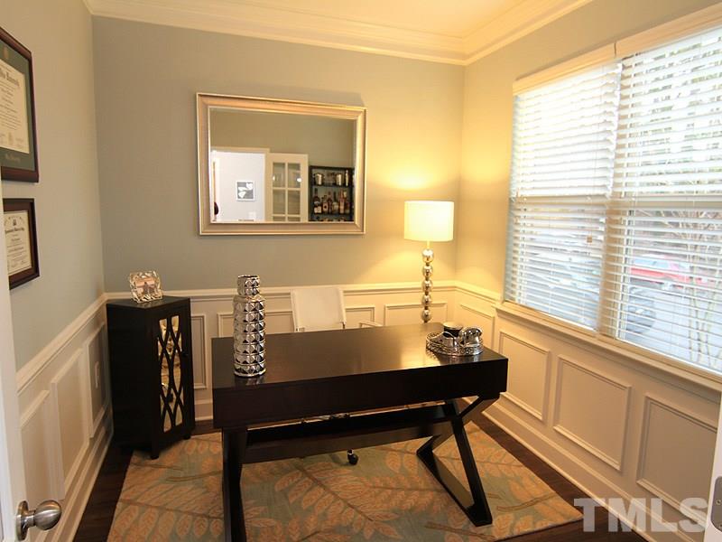2305 Lowden Street Raleigh, NC 27608 - Photo 3 of 25 a view of a workspace with furniture and a window
