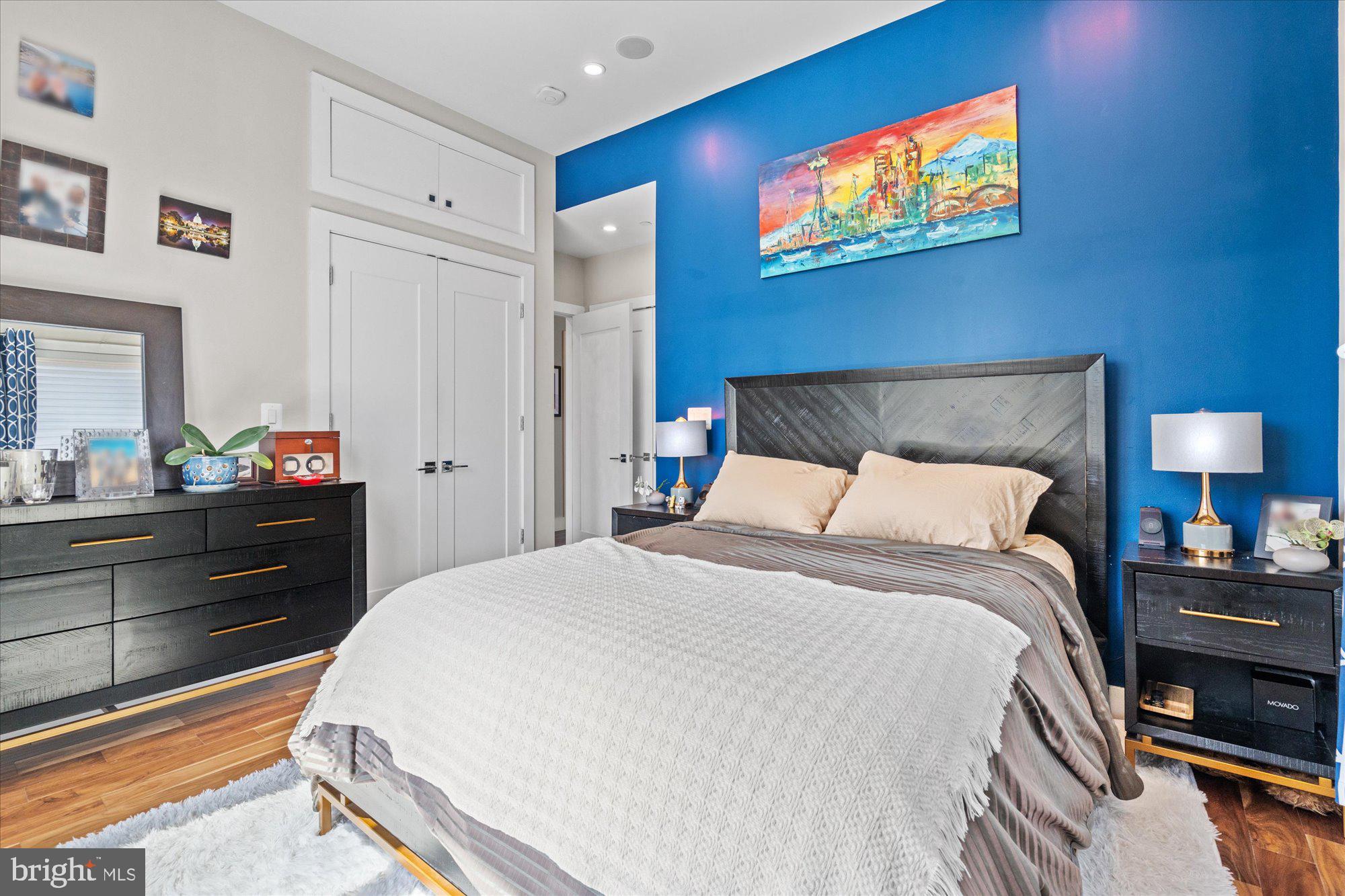 1337 K Street Southeast, Unit PH2 Washington, DC 20003 - Photo 12 of 22 Chic bedroom with vibrant blue accents.