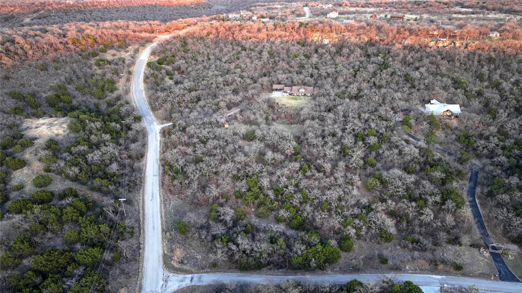 0 Art's Way Gordon, TX 76453 - Photo 5 of 5 a view of a dry yard with large trees