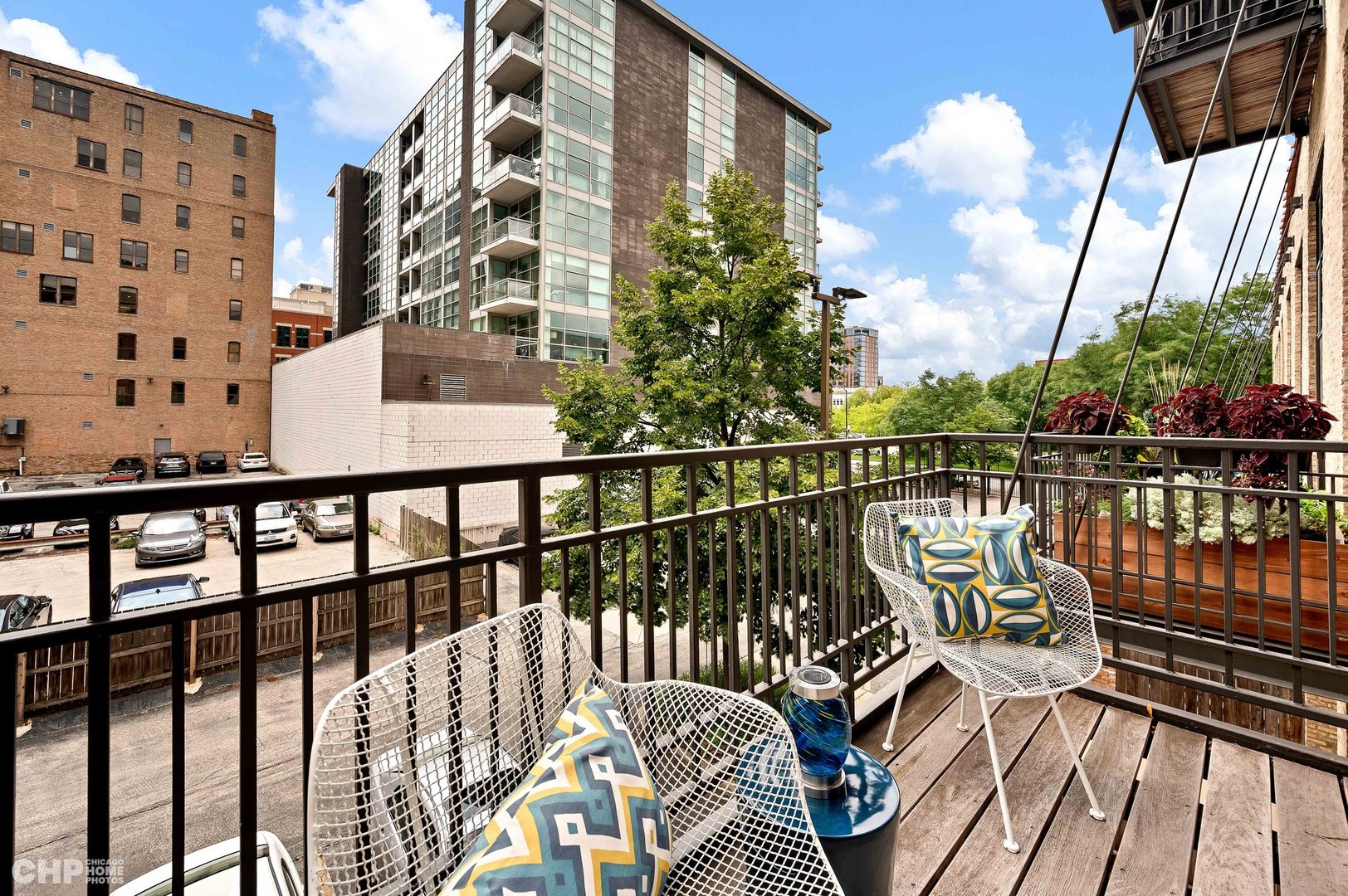 203 South Sangamon Street, Unit 206 Chicago, IL 60607 - Photo 18 of 20 a view of balcony with wooden floor and iron fence