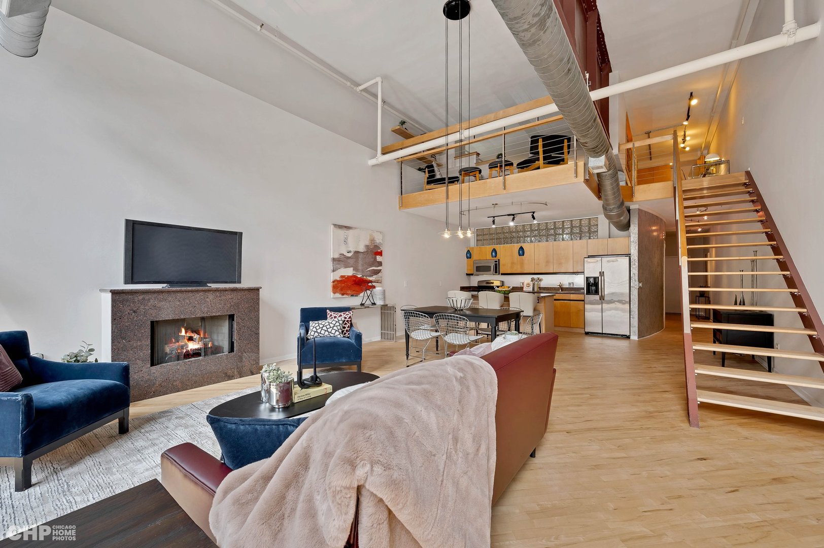 203 South Sangamon Street, Unit 206 Chicago, IL 60607 - Photo 3 of 20 a living room with furniture and a fireplace