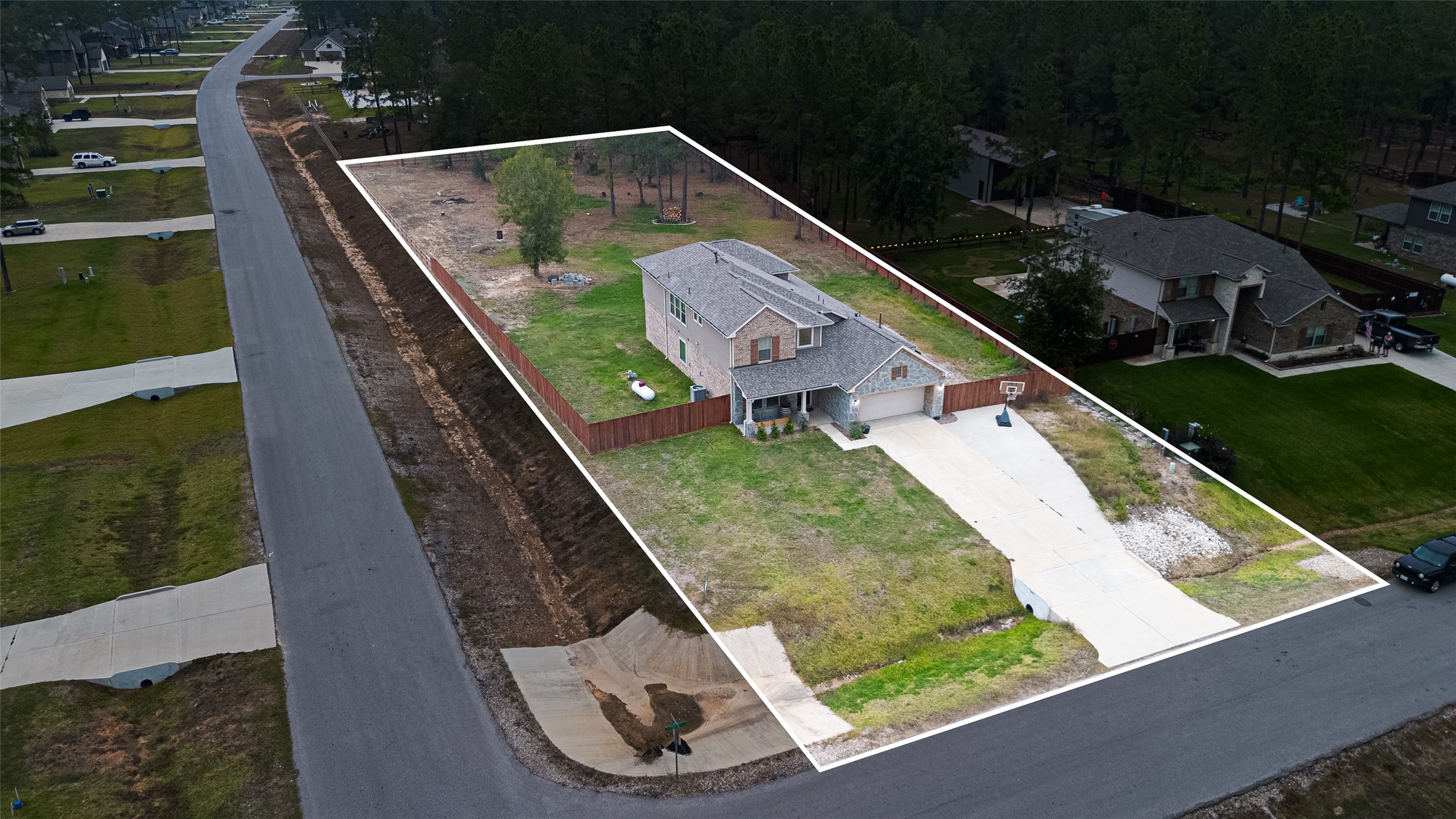 16601 Crosby Street Conroe, TX 77303 - Photo 2 of 50 Aerial view showcasing the expansive property lines, oversized lot, and peaceful surrounding neighborhood—offering ample space and privacy.
