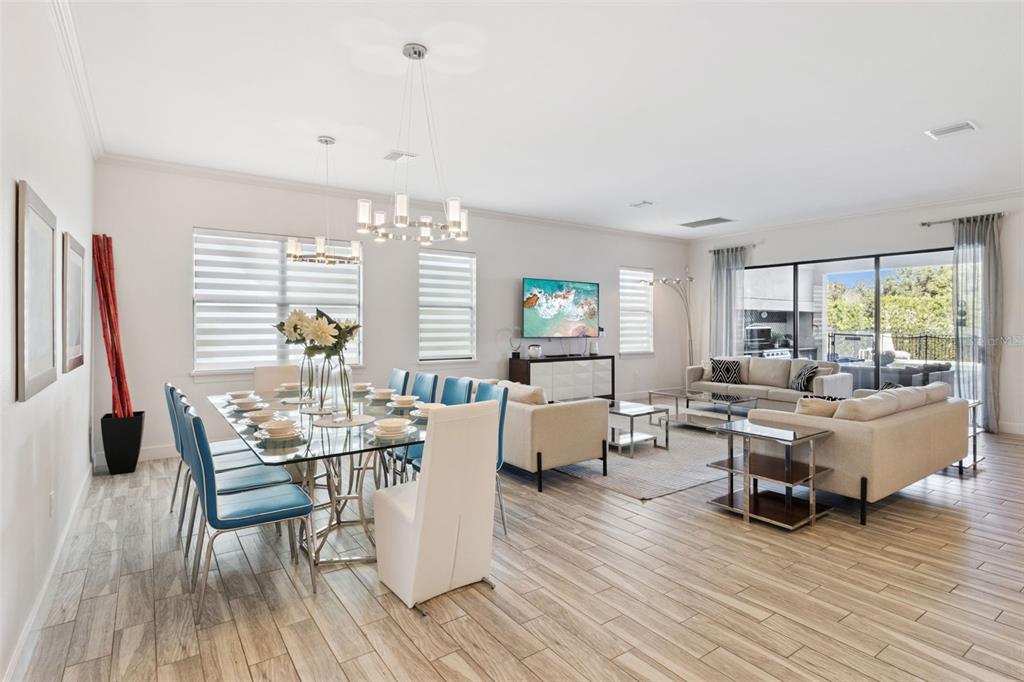 7423 Sparkling Court Reunion, FL 34747 - Photo 13 of 62 a living room with furniture and a wooden floor