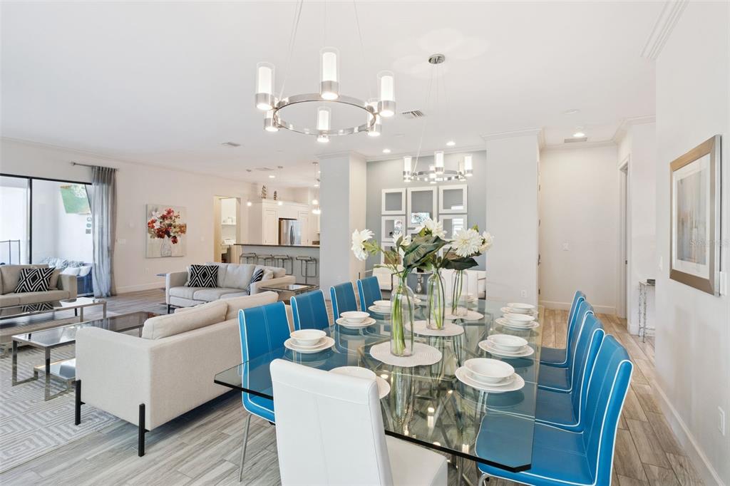 7423 Sparkling Court Reunion, FL 34747 - Photo 14 of 62 a view of a dining room with furniture and wooden floor