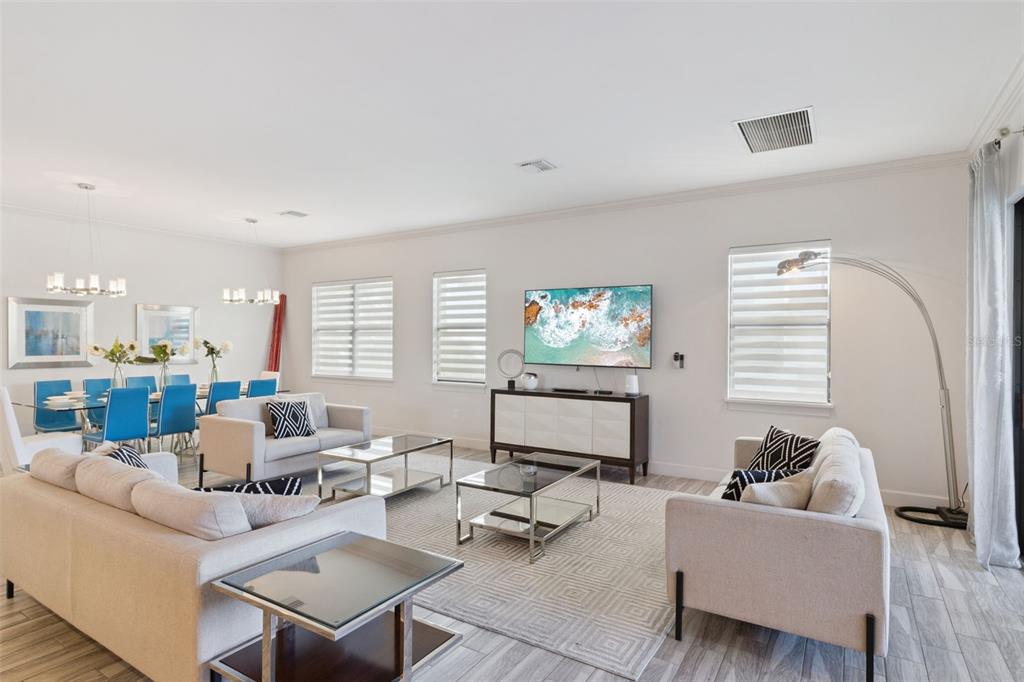 7423 Sparkling Court Reunion, FL 34747 - Photo 16 of 62 a living room with furniture and a flat screen tv