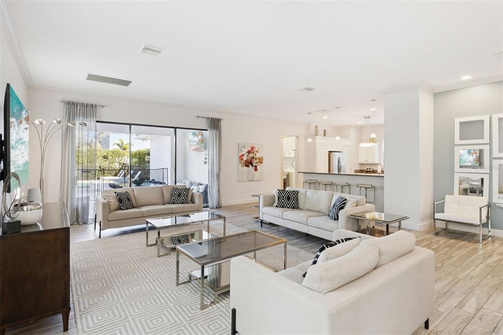 7423 Sparkling Court Reunion, FL 34747 - Photo 17 of 62 a living room with furniture and a large window