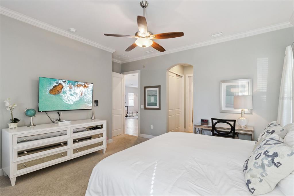 7423 Sparkling Court Reunion, FL 34747 - Photo 20 of 62 a bedroom with bed and a flat screen tv