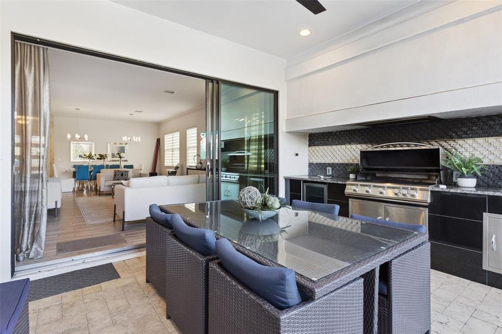 7423 Sparkling Court Reunion, FL 34747 - Photo 35 of 62 a kitchen with stainless steel appliances granite countertop a sink a stove and a refrigerator