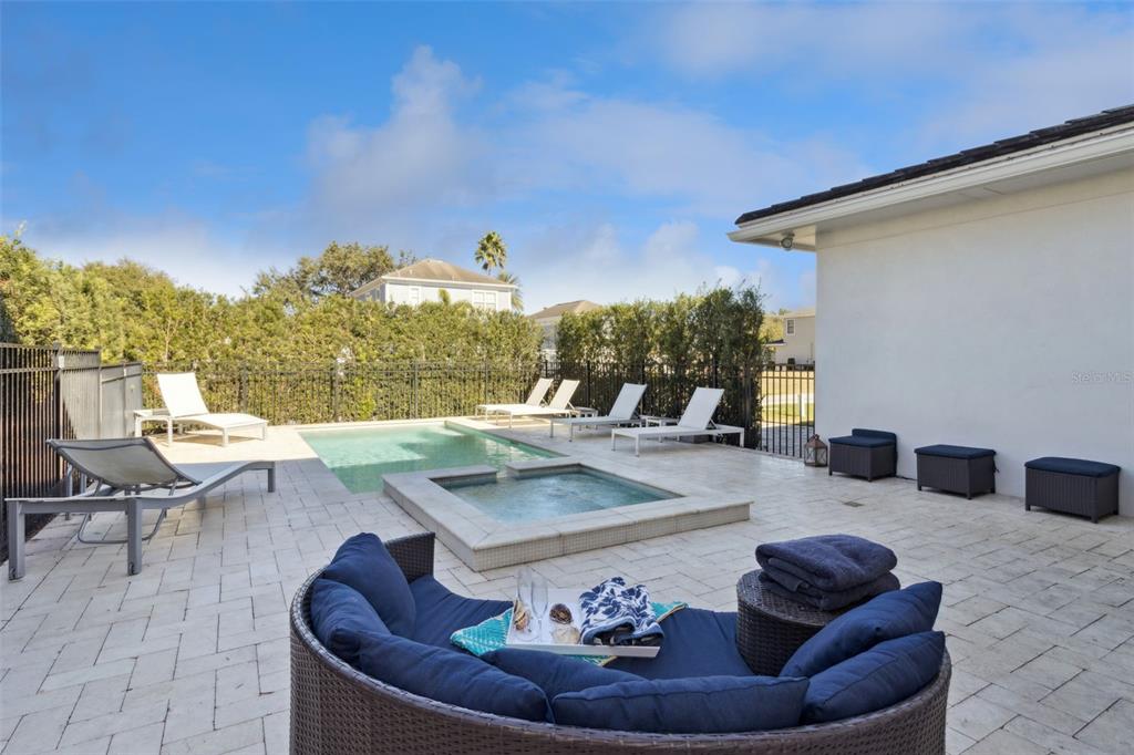 7423 Sparkling Court Reunion, FL 34747 - Photo 36 of 62 a view of a couches and dinning table in patio