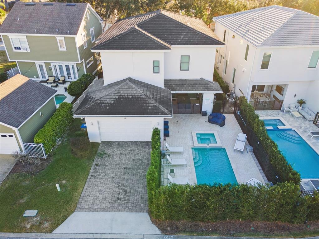7423 Sparkling Court Reunion, FL 34747 - Photo 38 of 62 an aerial view of a house with a yard
