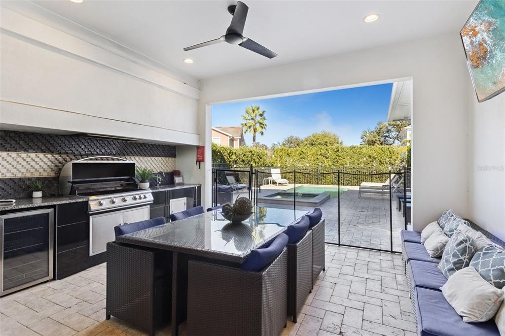 7423 Sparkling Court Reunion, FL 34747 - Photo 4 of 62 a kitchen with a stove refrigerator sink and a microwave