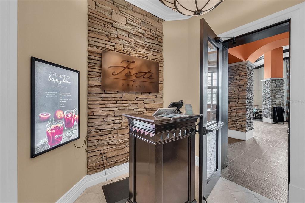 7423 Sparkling Court Reunion, FL 34747 - Photo 54 of 62 a hall with a stove and a painting on the wall