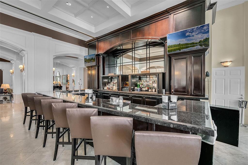 7423 Sparkling Court Reunion, FL 34747 - Photo 55 of 62 a kitchen with stainless steel appliances granite countertop a stove and a sink