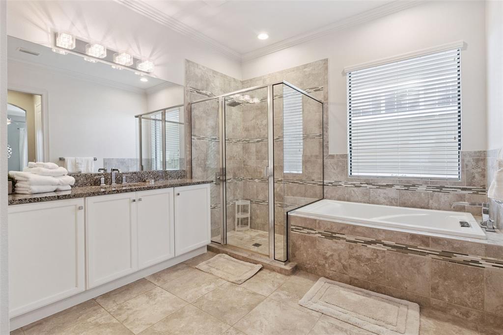 7423 Sparkling Court Reunion, FL 34747 - Photo 7 of 62 a spacious bathroom with sink shower and bathtub
